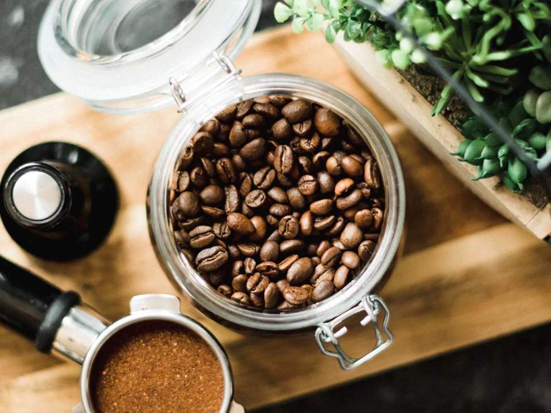 Roasted coffee beans in storage containers
