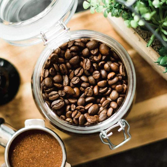 Roasted coffee beans in storage containers