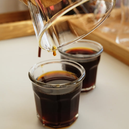 Coffee being poured from coffee pot 