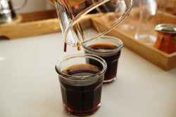 Coffee being poured from coffee pot 