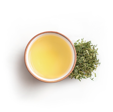 Tea leaves and a cup of tea on a white background