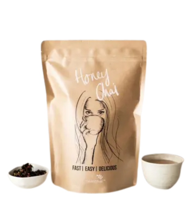 Image of real chai honey with cup of latte and loose chai leaves 